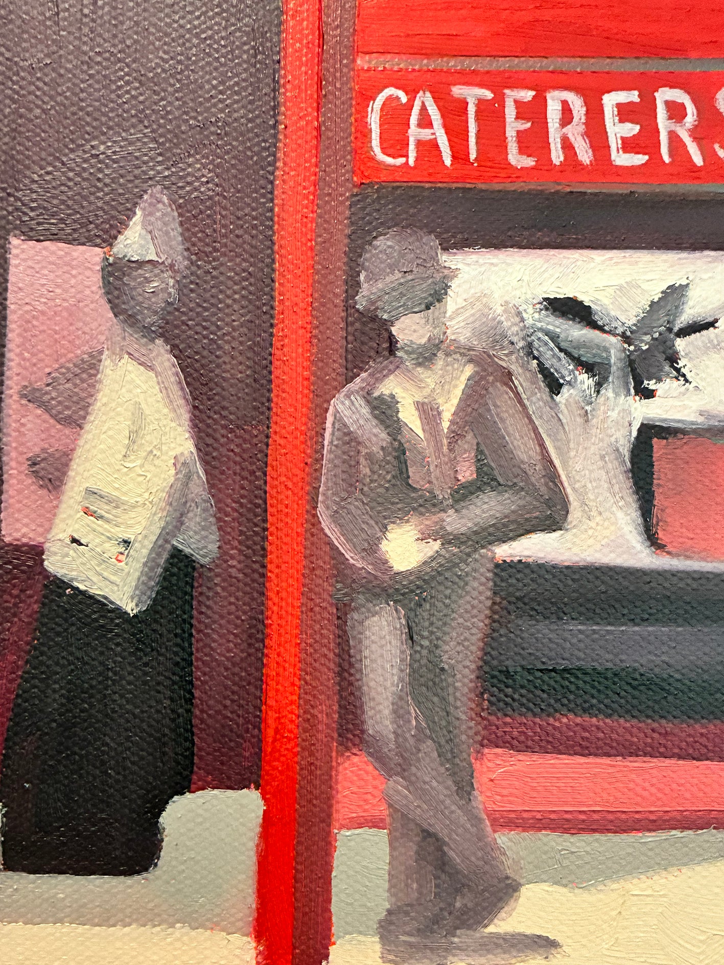 Two people standing next to a red vehicle with 'CATERERS' written on it.