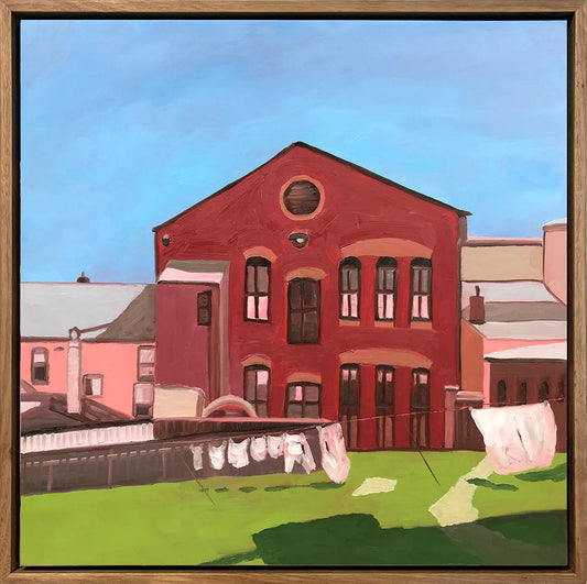 Painting of a red brick building with a blue sky and green grass.