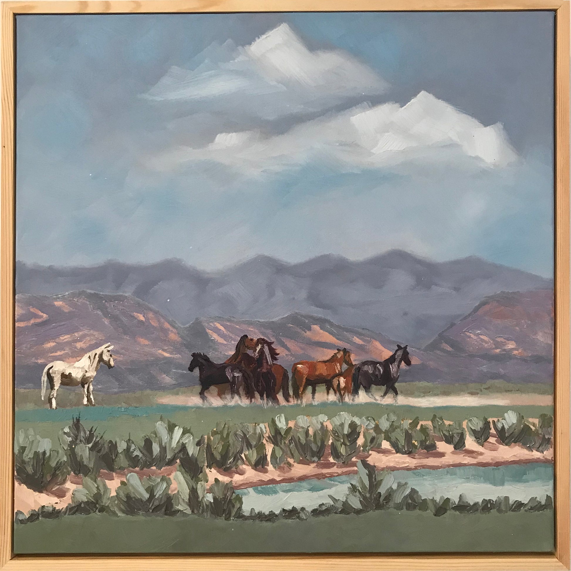 Painting of horses in a field with mountains in the background